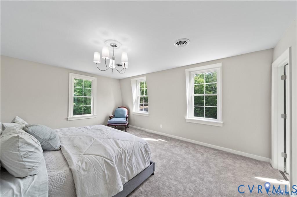 20010 River Road Chesterfield, VA 23838 - Photo 18 of 36 a bedroom with a bed and a window