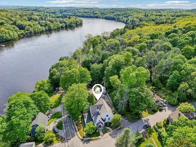 an aerial view of a house with a yard and a garden view