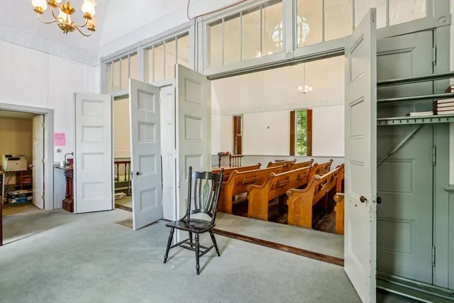 a bedroom with a bed and a mirror