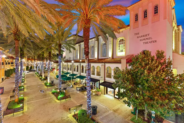 front view of a building with a tree