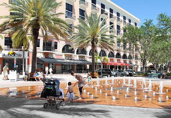 a view of street with along with palm trees