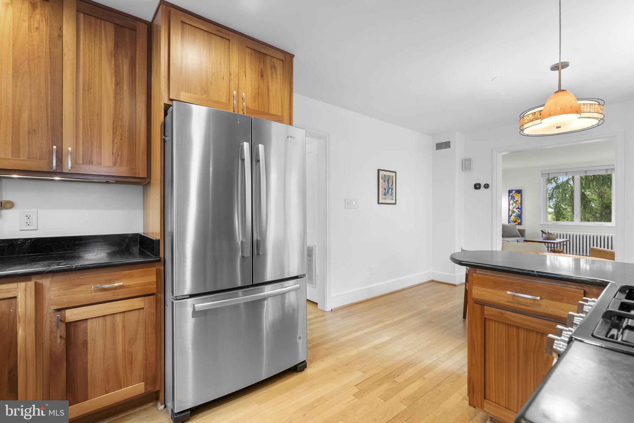314 Dale Drive Silver Spring, MD 20910 - Photo 15 of 49 a kitchen with stainless steel appliances granite countertop a refrigerator a sink and dishwasher