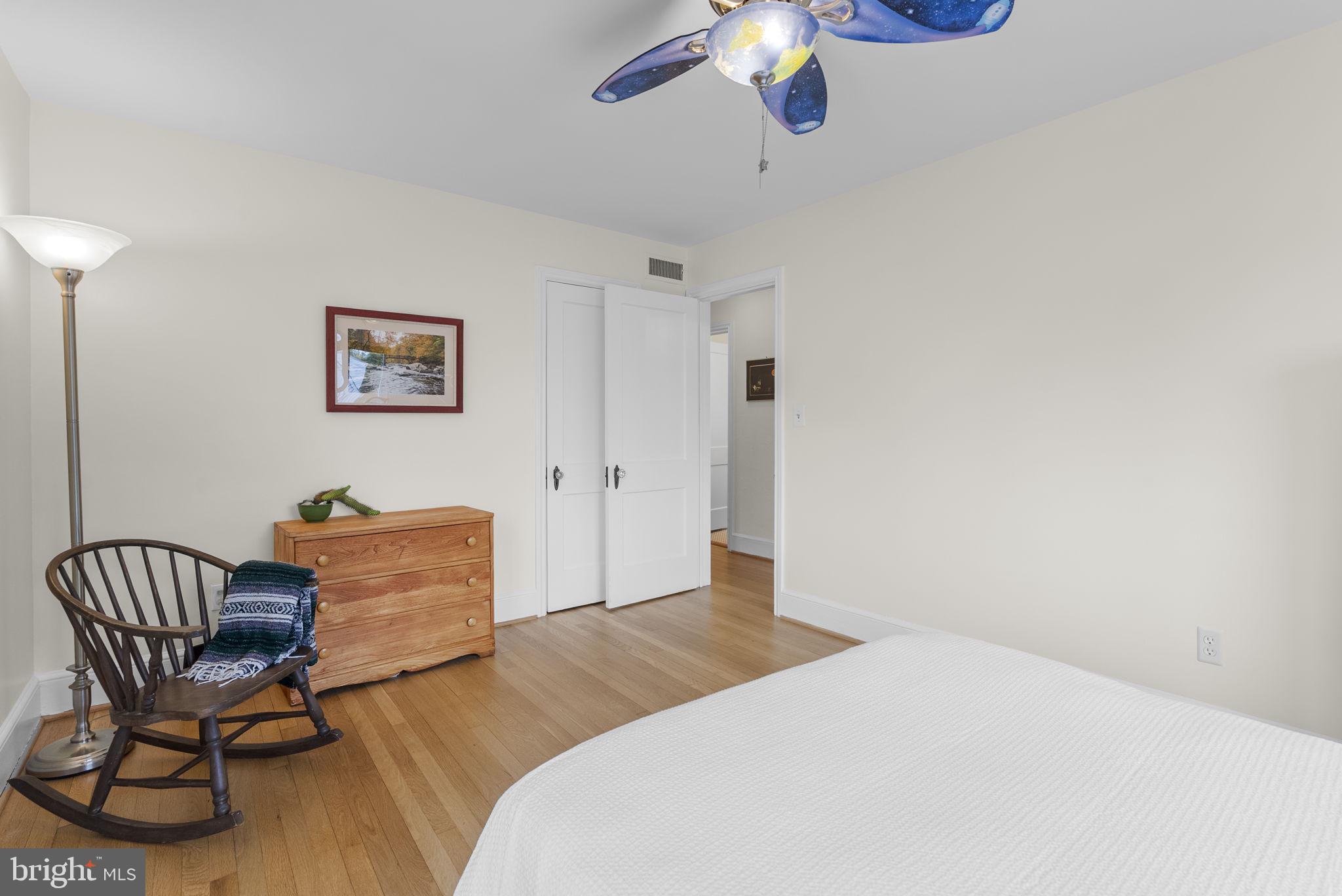 314 Dale Drive Silver Spring, MD 20910 - Photo 20 of 49 a bedroom with a bed and chair