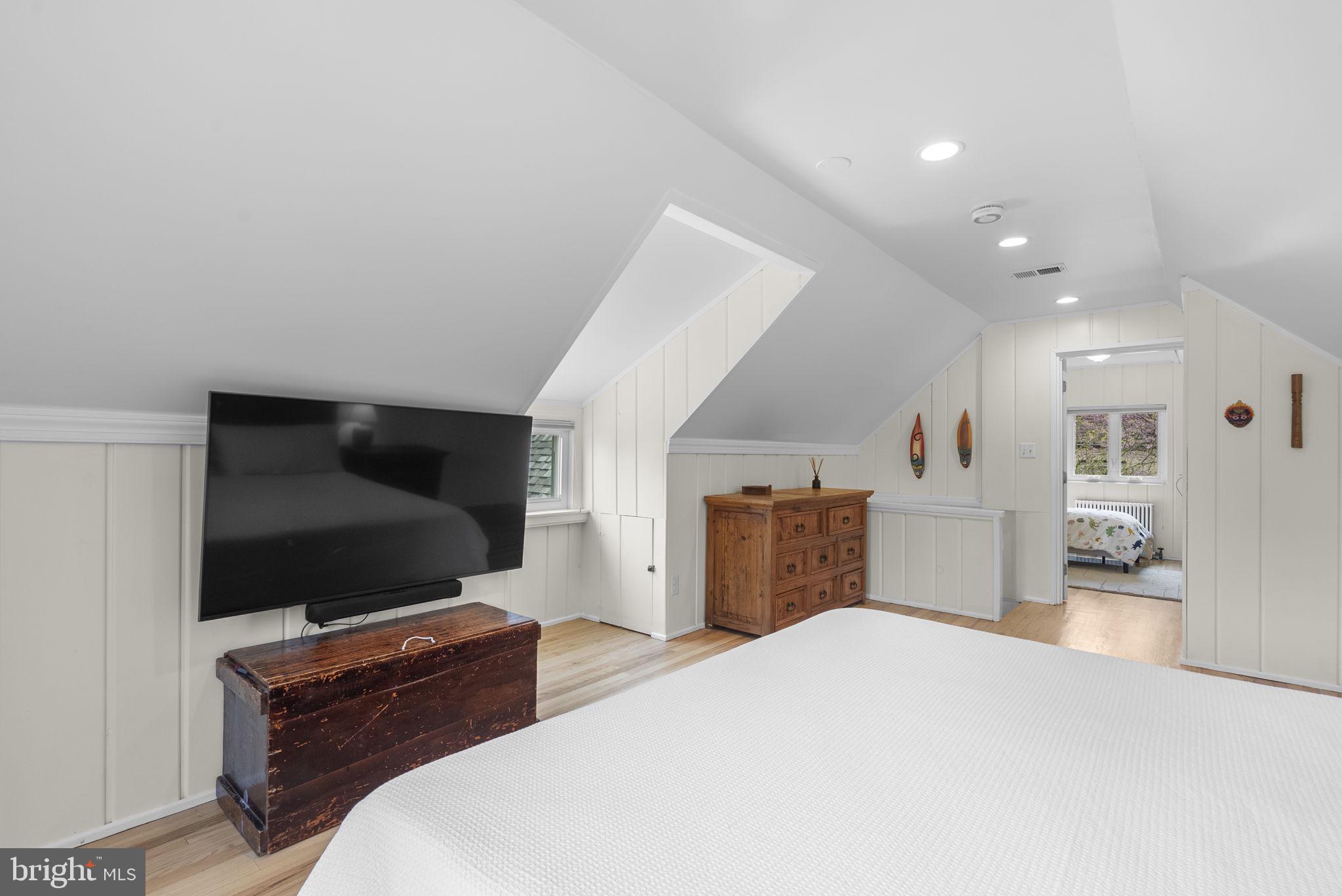 314 Dale Drive Silver Spring, MD 20910 - Photo 24 of 49 a bedroom with a bed and a flat screen tv