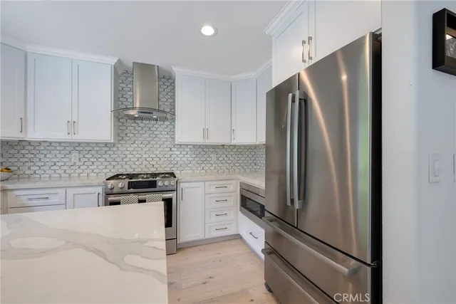 a view of a storage and utility room with washer and dryer