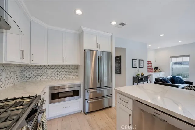 a view of a dining room with furniture wooden floor and windows