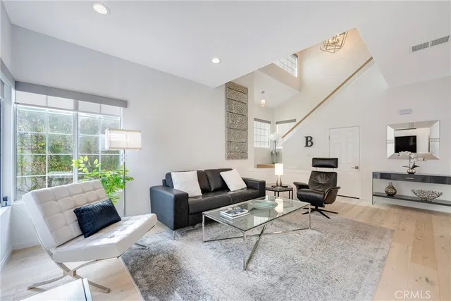 a bathroom with a sink toilet a mirror and shower