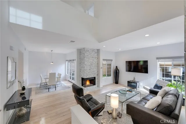 a bedroom with a large bed and a flat screen tv