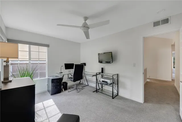 a view of backyard with outdoor seating and plants