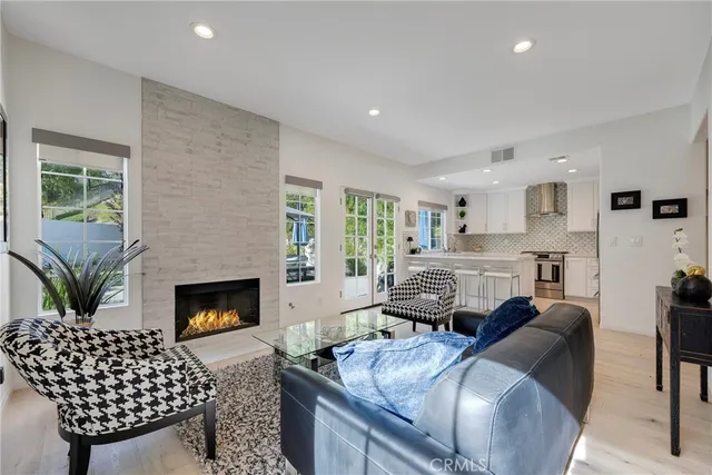 a kitchen with stainless steel appliances a refrigerator sink and stove