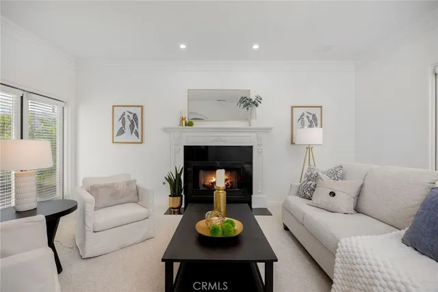 a living room with furniture and a lamp