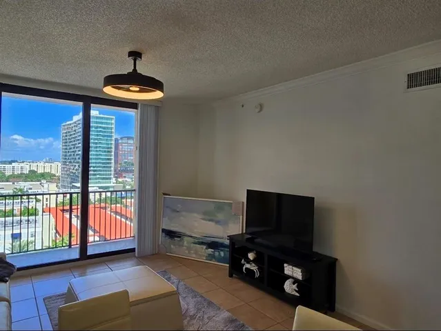 a view of a balcony with an outdoor seating