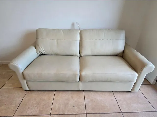 a living room with a couch and table
