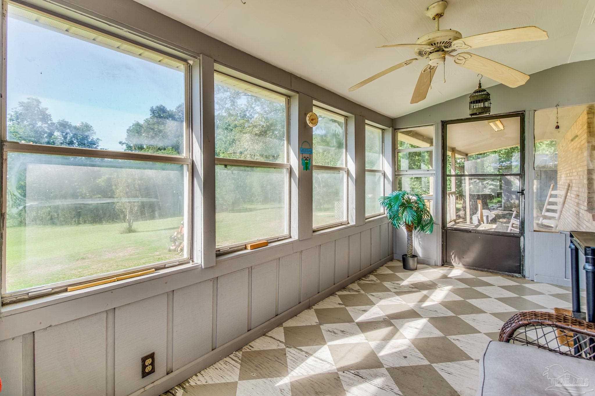 6201 Meadows Road Walnut Hill, FL 32568 - Photo 8 of 50 a view of a room with a large window