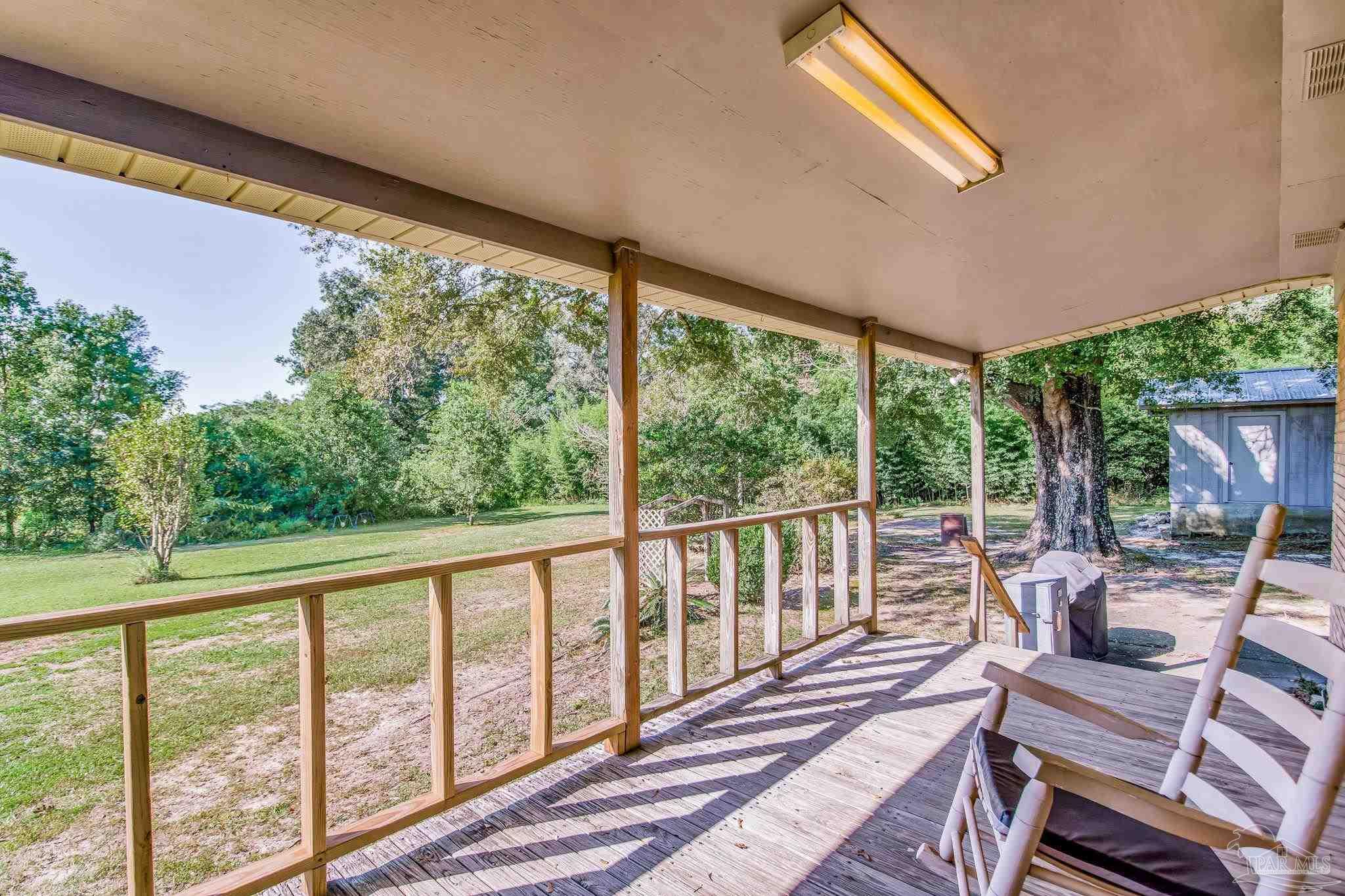 6201 Meadows Road Walnut Hill, FL 32568 - Photo 9 of 50 a view of a two chairs in the balcony