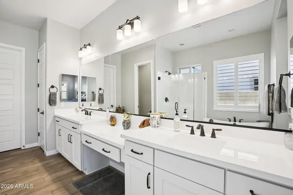 a white bath tub sitting next to a shower