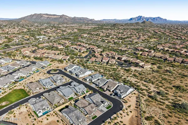 a view of a house with a yard porch and sitting area
