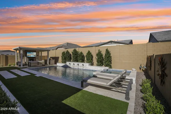a view of a swimming pool with a patio