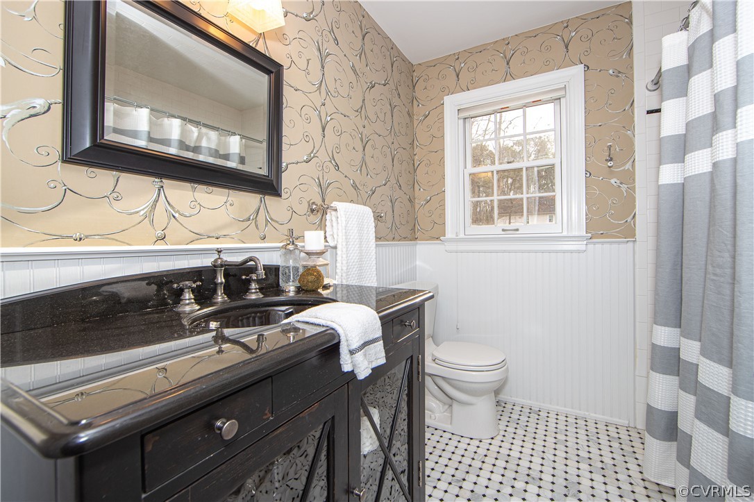 4010 Poplar Grove Road Midlothian, VA 23112 - Photo 26 of 49 a bathroom with a sink a toilet and a mirror