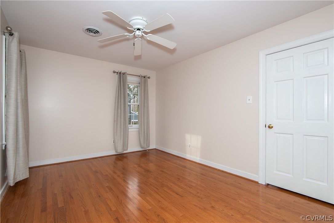 4010 Poplar Grove Road Midlothian, VA 23112 - Photo 28 of 49 a view of an empty room with wooden floor