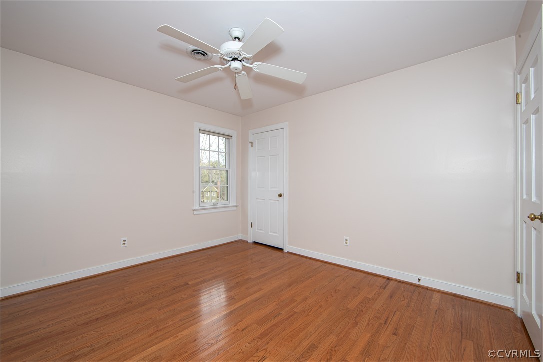 4010 Poplar Grove Road Midlothian, VA 23112 - Photo 29 of 49 a view of an empty room with wooden floor and a window
