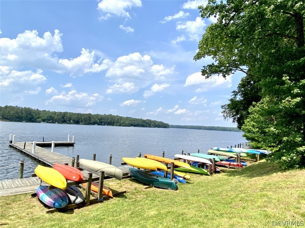 4010 Poplar Grove Road Midlothian, VA 23112 - Photo 43 of 49 a view of a lake with lawn chairs and a big yard