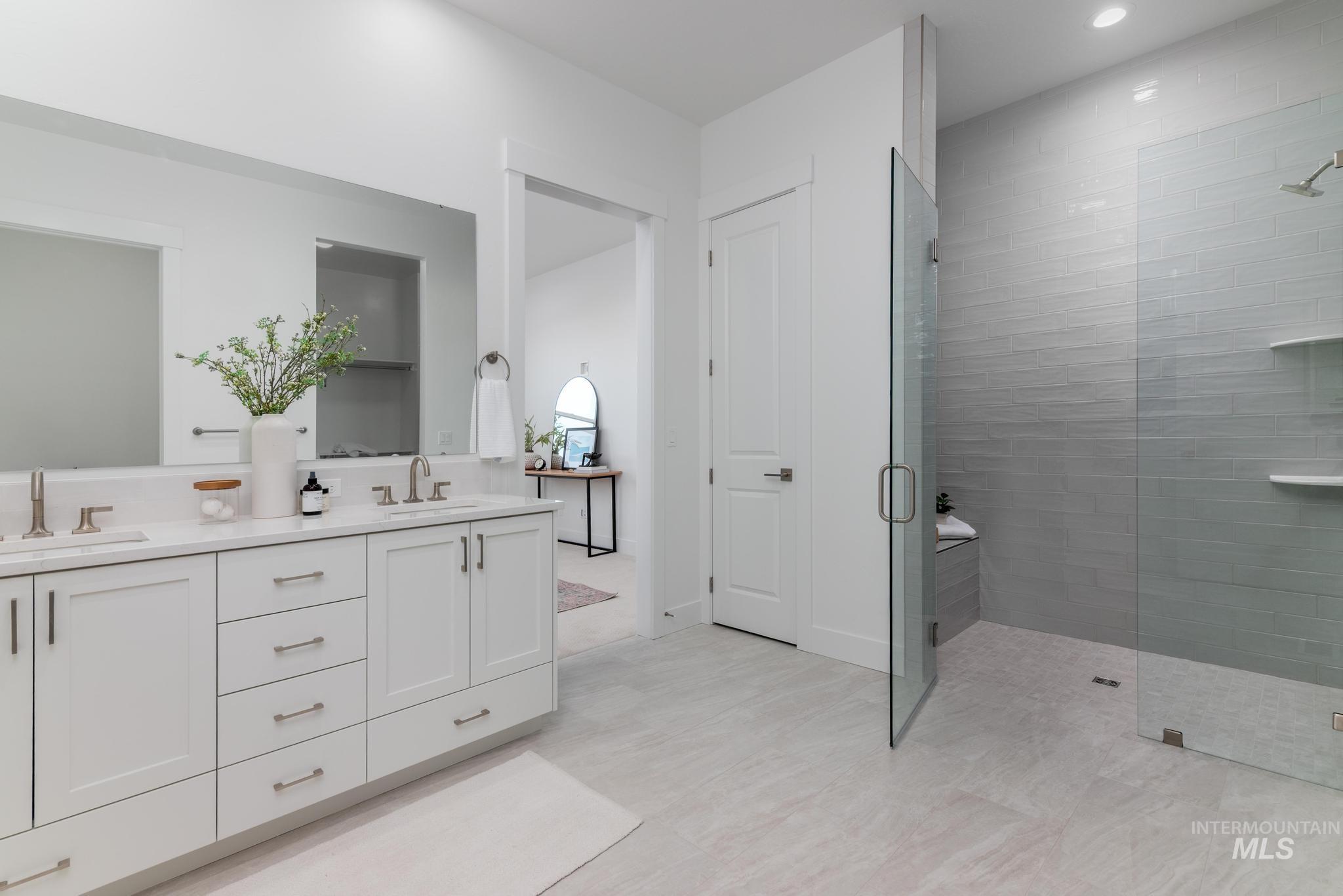 8520 West Fanning Street Star, ID 83669 - Photo 9 of 11 Bathroom featuring double vanity, a stall shower, and recessed lighting
