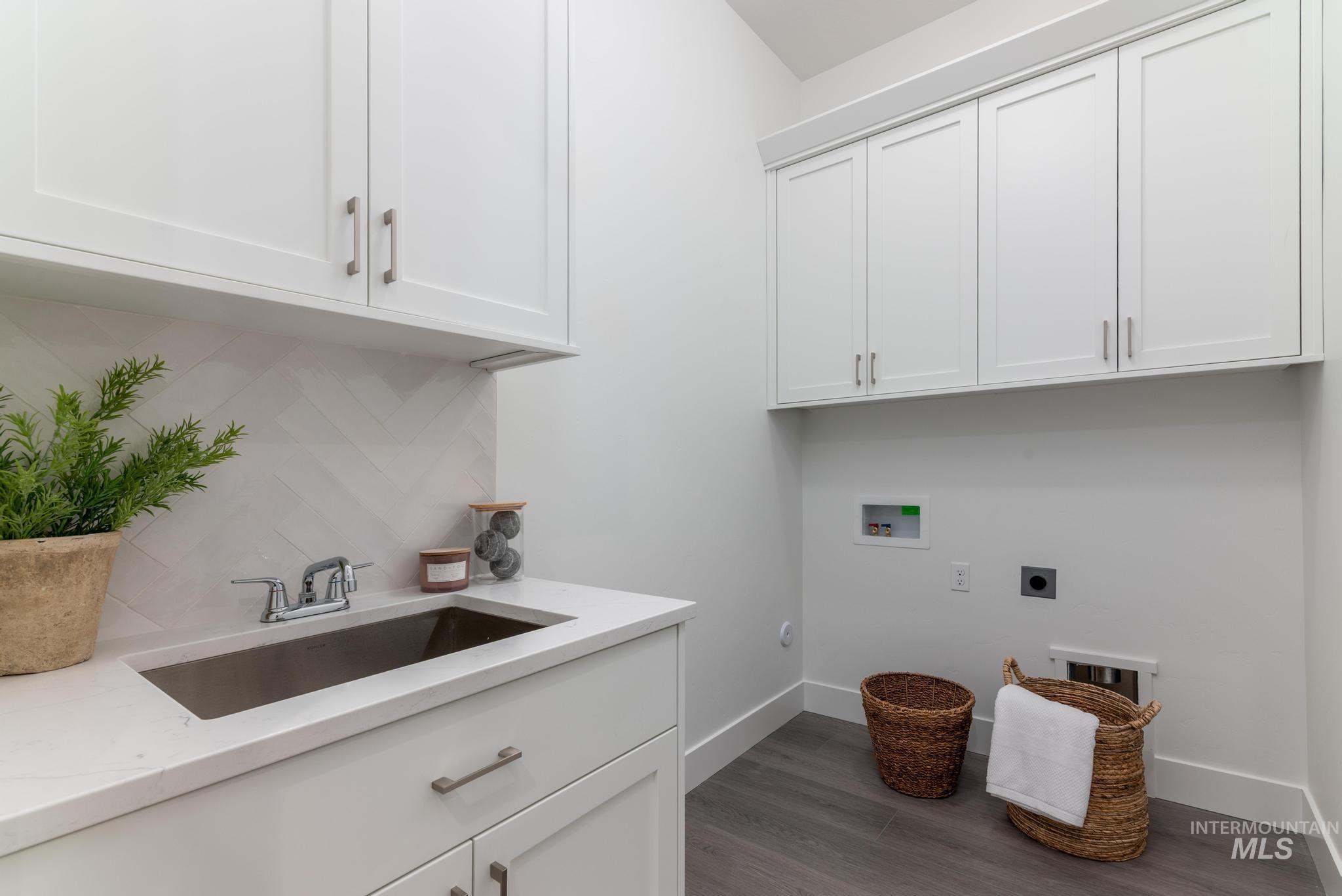 8520 West Fanning Street Star, ID 83669 - Photo 10 of 11 Washroom featuring hookup for a washing machine, electric dryer hookup, dark wood-type flooring, and cabinet space