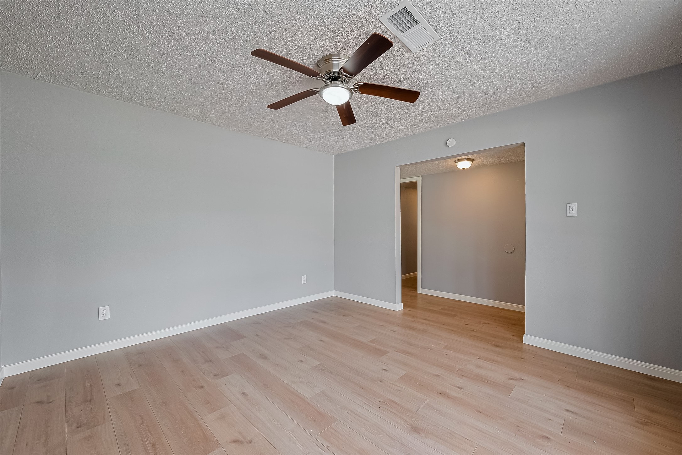 206 Beaver Bend Road Houston, TX 77037 - Photo 13 of 38 a view of an empty room with wooden floor