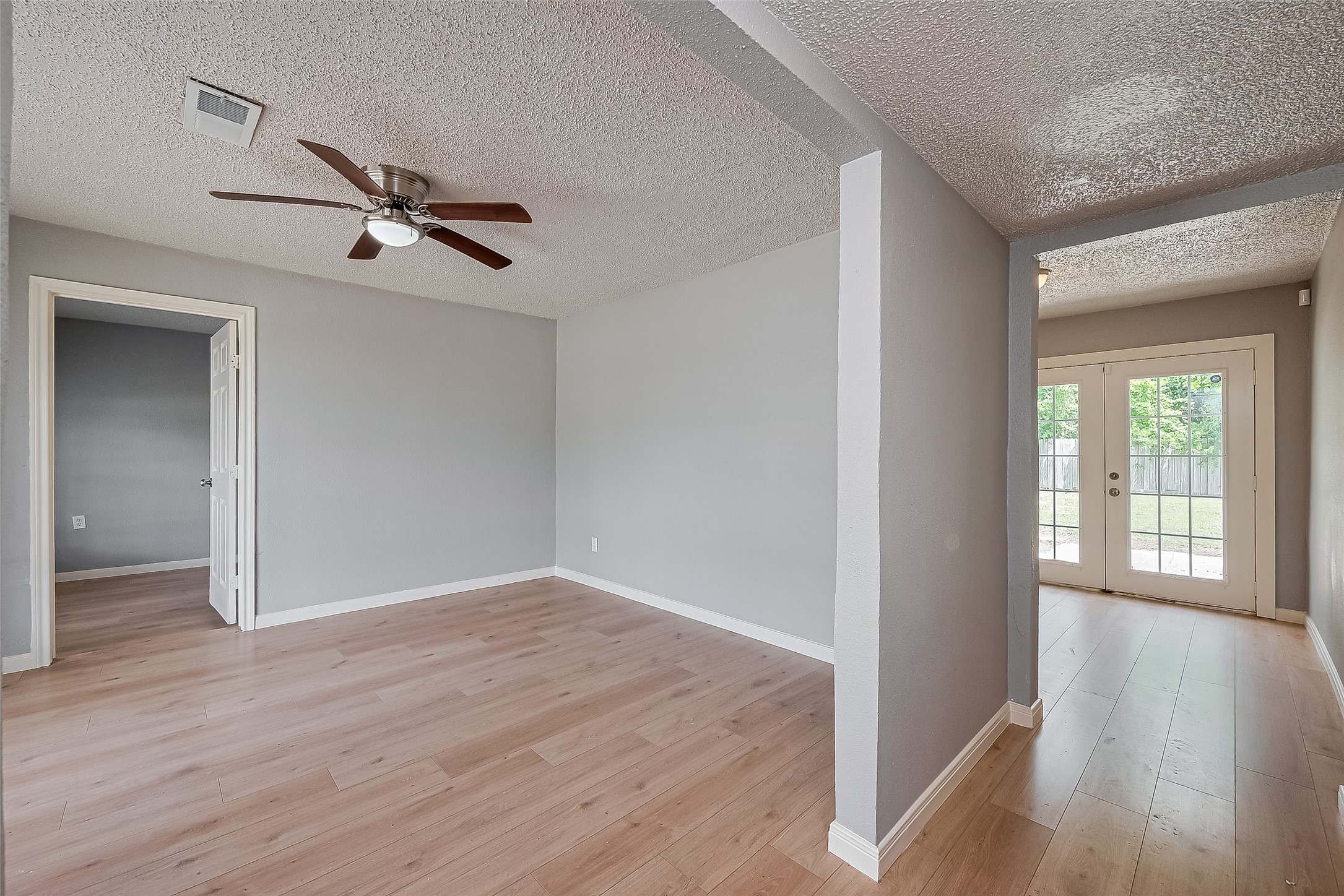 206 Beaver Bend Road Houston, TX 77037 - Photo 10 of 38 wooden floor in an empty room with a window