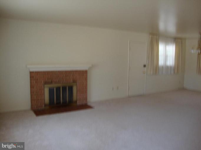 5236 Inverchapel Road Springfield, VA 22151 - Photo 5 of 7 a view of an empty room with a fireplace