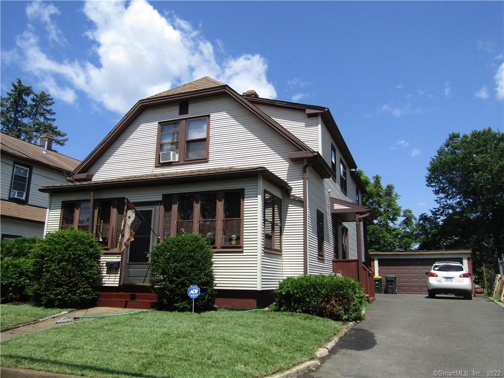 6 Murray Street Ansonia, CT 06401 - Photo 1 of 1 a view of a house with a small yard plants and a large tree