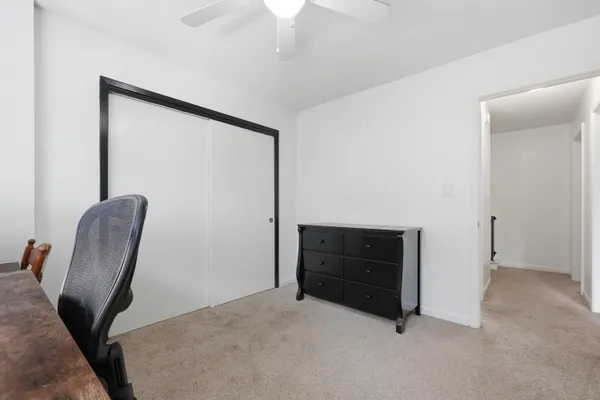 a room with furniture and a dresser