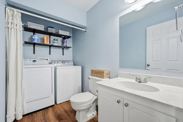 a bathroom with a sink toilet and vanity