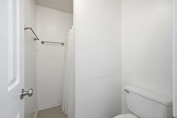 a view of backyard with deck and a garden