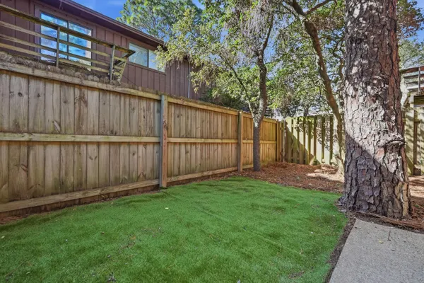 a view of backyard with a table and chairs