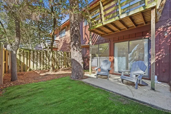 a view of backyard with a table and chairs