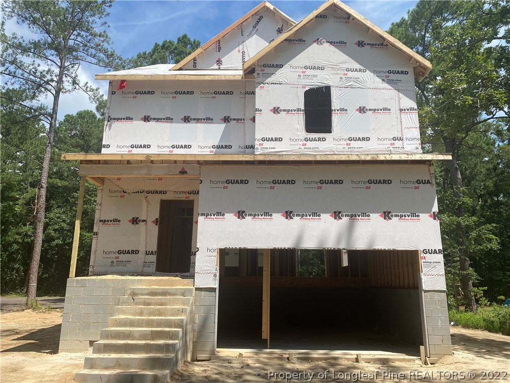 760 Daphne Lane Vass, NC 28394 - Photo 14 of 15 a view of a house with a balcony