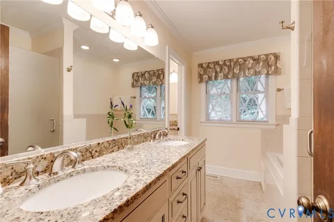 a bathroom with a granite countertop sink mirror and a