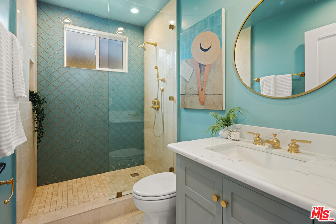 2613 5th Street Santa Monica, CA 90405 - Photo 14 of 30 a bathroom with a sink a toilet and shower