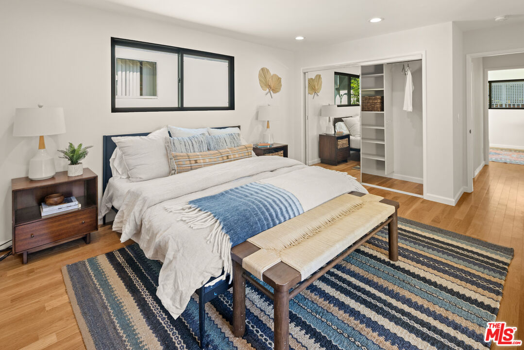 2613 5th Street Santa Monica, CA 90405 - Photo 18 of 30 a bedroom with a bed and wooden floor