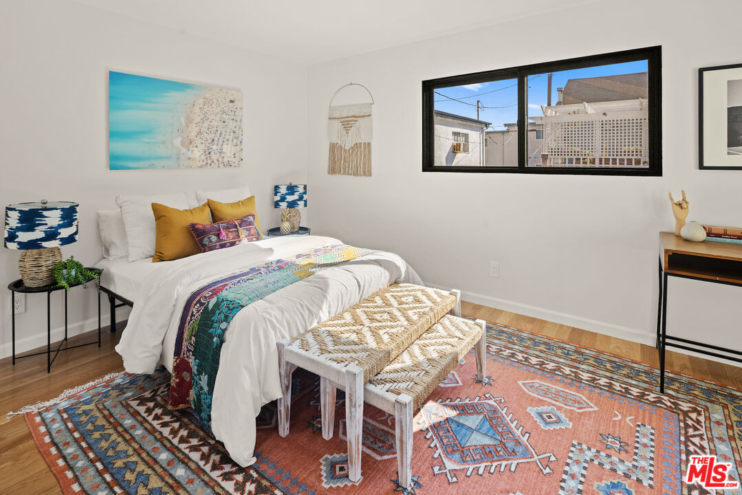 2613 5th Street Santa Monica, CA 90405 - Photo 20 of 30 a bed sitting in a bedroom next to a window