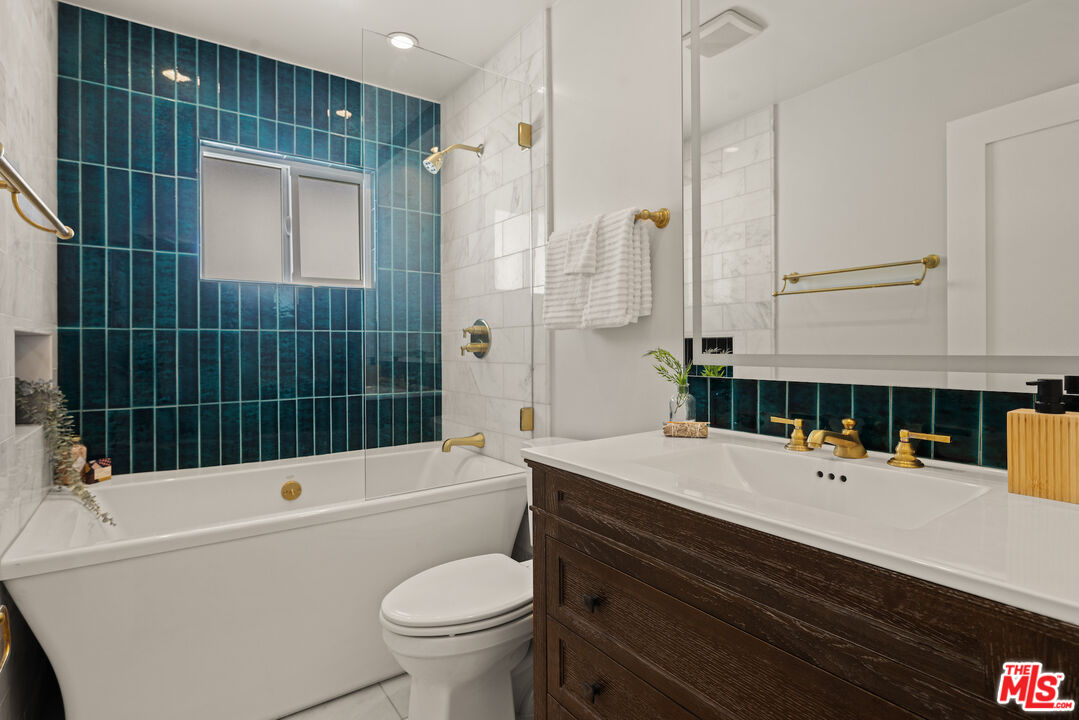 2613 5th Street Santa Monica, CA 90405 - Photo 24 of 30 a bathroom with a sink a toilet and shower