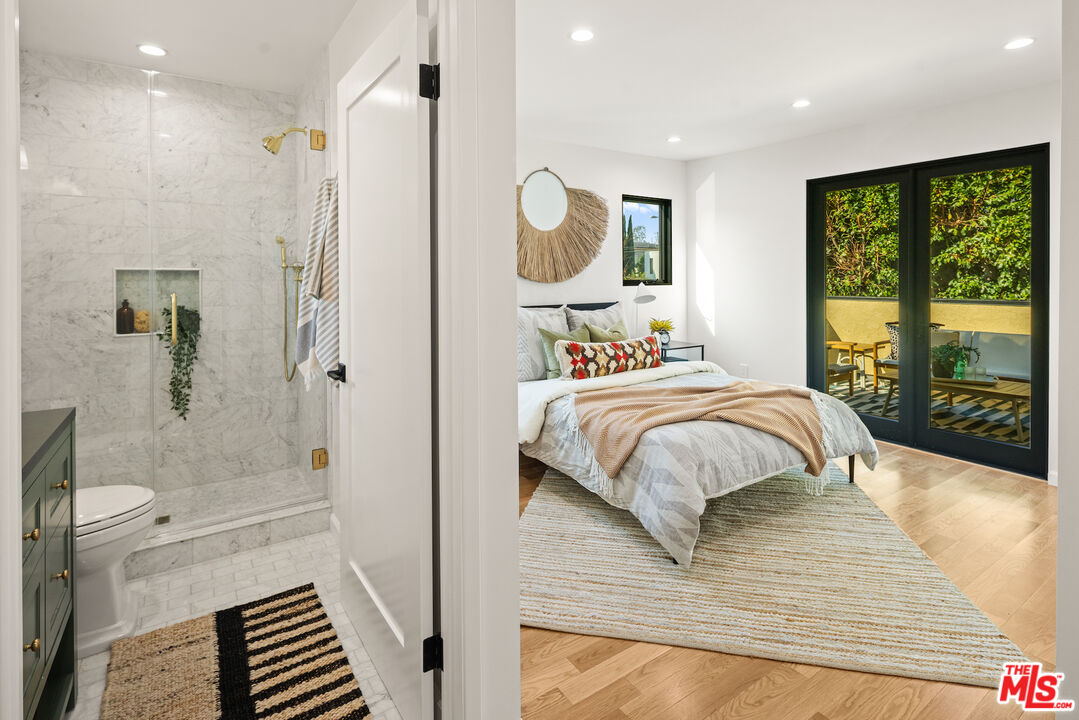 2613 5th Street Santa Monica, CA 90405 - Photo 26 of 30 a bedroom with a bed and a mirror