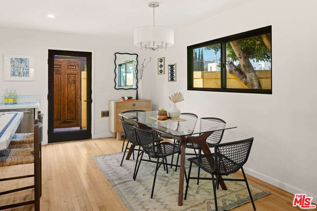 2613 5th Street Santa Monica, CA 90405 - Photo 6 of 30 a view of a dining room with furniture window and wooden floor