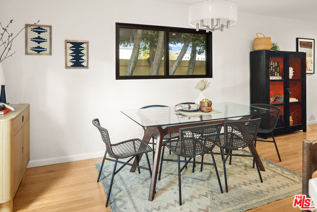 2613 5th Street Santa Monica, CA 90405 - Photo 10 of 30 a view of a dining room with furniture and wooden floor