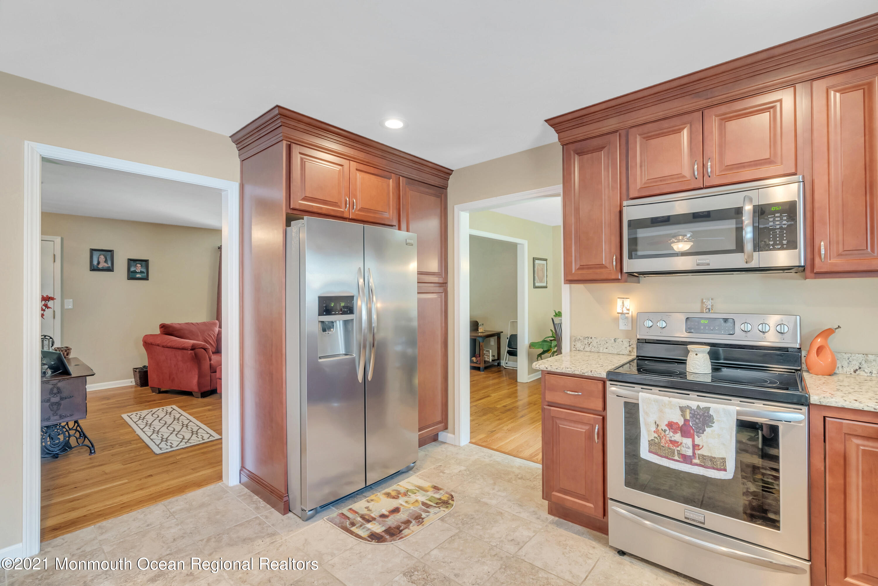 93 Jackson Mills Road Jackson, NJ 08527 - Photo 13 of 39 a kitchen with stainless steel appliances granite countertop a stove a microwave and a refrigerator