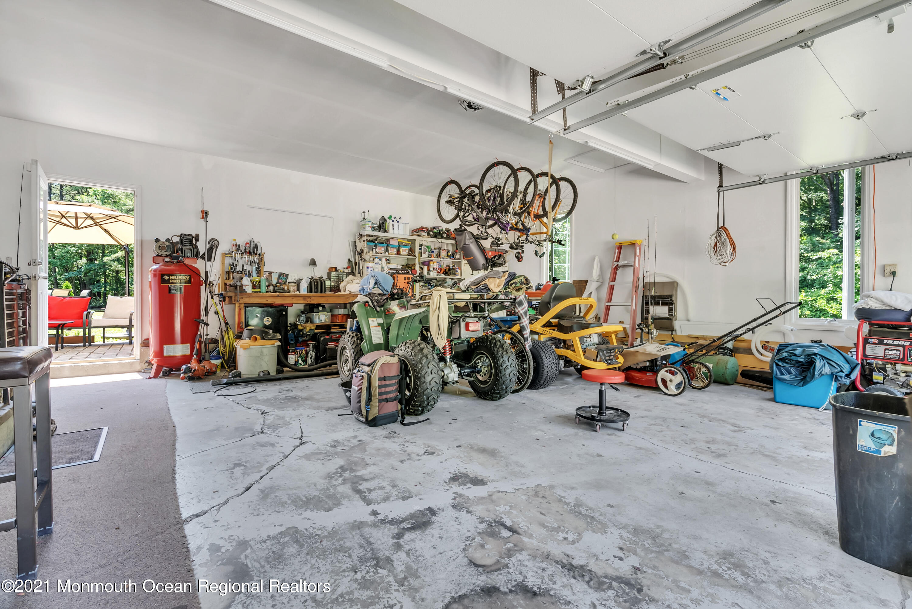 93 Jackson Mills Road Jackson, NJ 08527 - Photo 27 of 39 a view of a garage with a bike and car