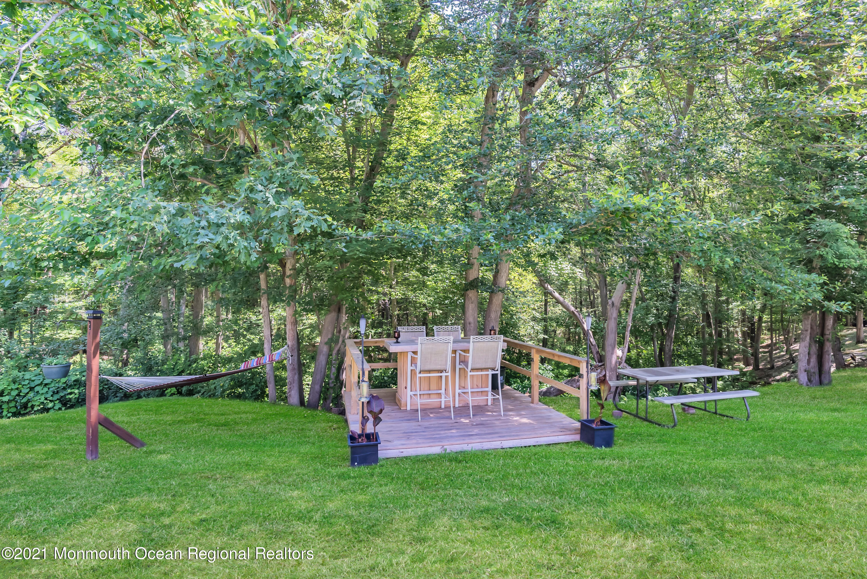 93 Jackson Mills Road Jackson, NJ 08527 - Photo 32 of 39 a view of a chair and table of the garden