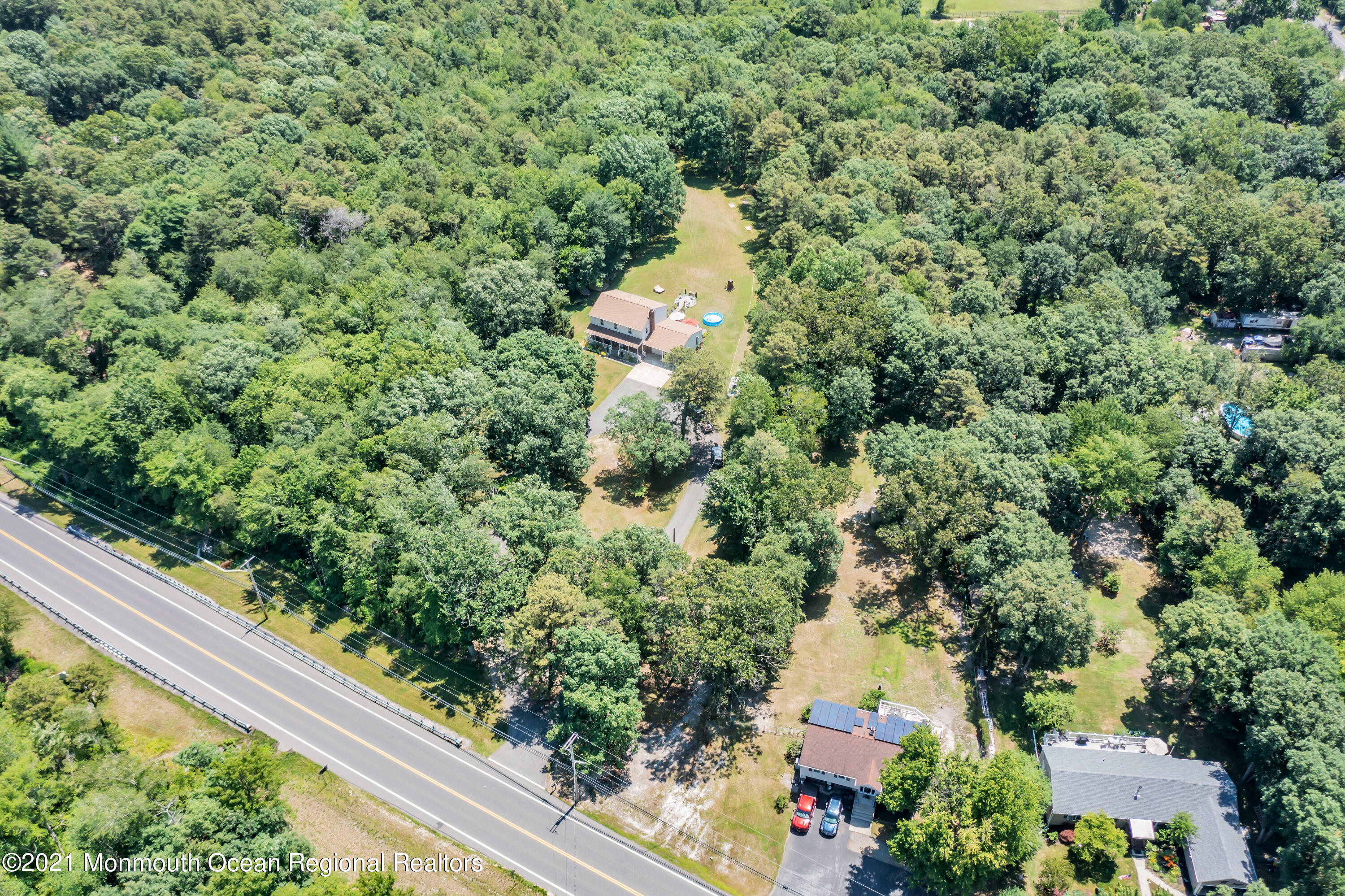 93 Jackson Mills Road Jackson, NJ 08527 - Photo 39 of 39 an aerial view of a house with a yard and outdoor seating